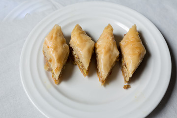 Close-up of Baklava, a dessert made with filo pastry and chopped nuts and sugar syrup.It is a popular turkish dessert