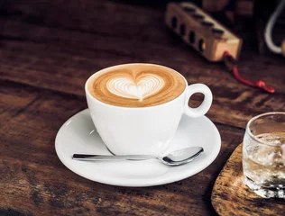 Foto op Plexiglas Vintage filtered,white coffee cup with heart shape latte art on © weedezign