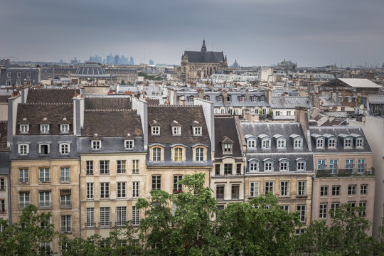 Paris aerial cityscape view of historical apartment buildings and Paroisse Saint-Eustache cathedral or the Church of Saint Eustache. View from the top of The Centre Pompidou modern art museum.