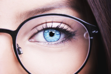 Beautiful young woman wearing glasses close-up