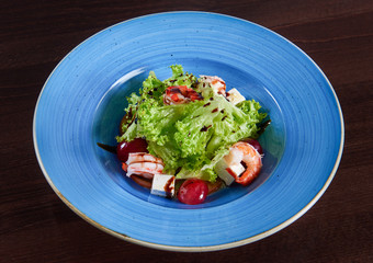 Delicious shrimp salad served on a blue plate