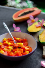 Healthy vegan breakfast of raw tropical fruits.
