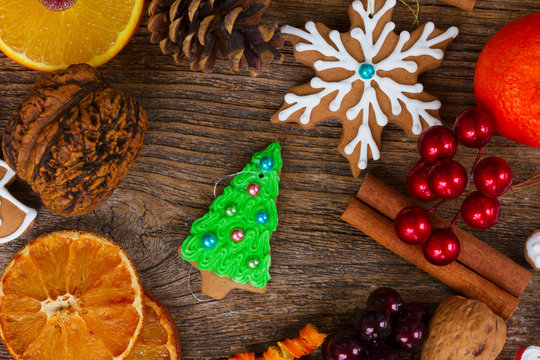 christmas gingerbread green fir tree cookie with spices and decorations