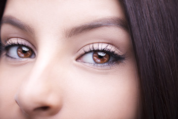 Fototapeta premium Beautiful insightful look brown woman's eyes