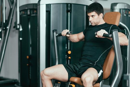 Gym Workout - Male athlete on chest press