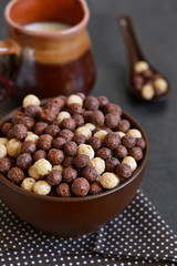 Obraz premium Healthy breakfast. Chocolate breakfast cereal with milk.
