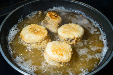 Fish deep frying in pan