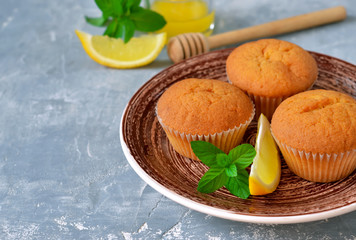 Homemade, lemon muffins with honey and mint.