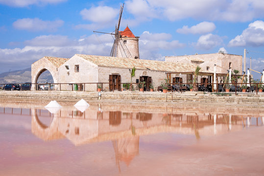 View of windmill in the salt pans, Trapani. Sicily - August 2016