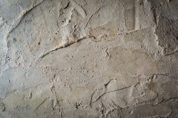 Old destroyed concrete wall with uneven structure