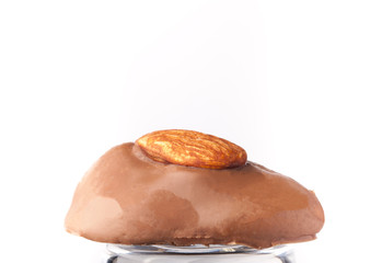 One chocolate candy on a light background