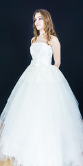 Fototapeta premium bride on black background. dress