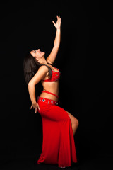 Beautiful belly dancer performing exotic dance