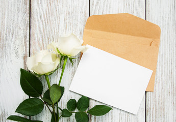 White roses and envelope