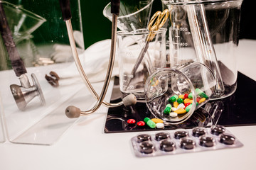 medicine and medical instruments on table