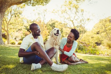 Couple posing with a dog