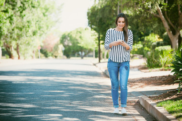 female on a smart phone outside