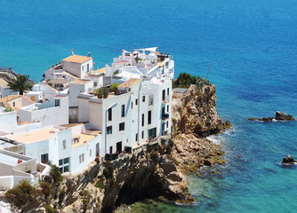 Houses built on a cliff coast, Ibiza Island.