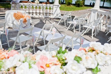 wedding arch with chairs and many flowers and decor