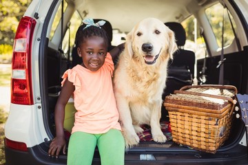 Happy girl posing with her dog