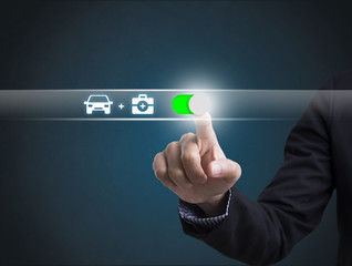 Businessman hand pressing button protection car concept travel insurance. sign on virtual screen.