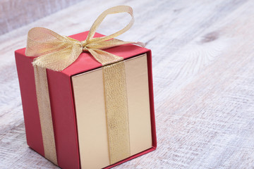 Gift boxes with bow on wood background