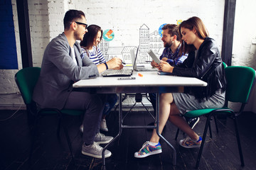 Team job. Photo young businessmans crew working with new startup project in modern loft