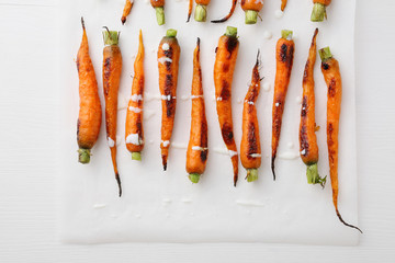  Roasted carrots on white wood
