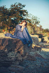 young woman on stone