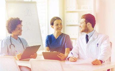 group of happy doctors meeting at hospital office