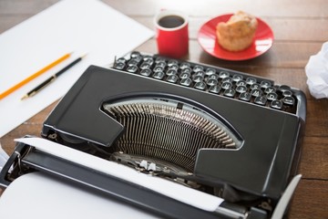 Aerial view of typewriter putting on desk 