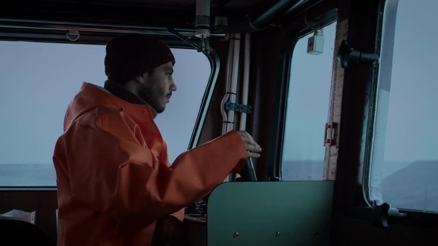 Captain Pilots Commercial Fishing Ship. Shot on RED Cinema Camera in 4K (UHD). 