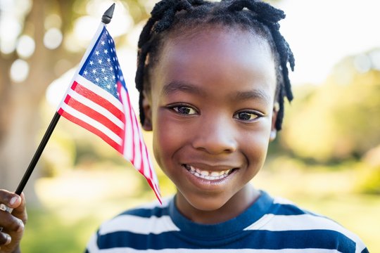 Happy child holding an USA flag