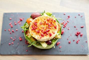 goat cheese salad with vegetables at restaurant