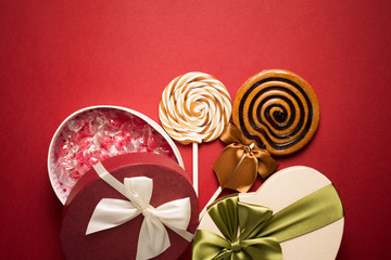 Brown Sweet Lollipops For Children And Candy Box Red Background
