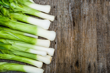 Fresh leeks, green vegetables, farm fresh produce on farmer table