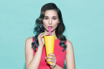 Portrait of beautiful woman with paper cup.