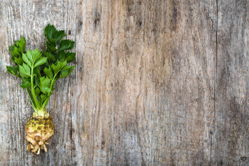 Root of celery with leaves, green vegetables, local market produce