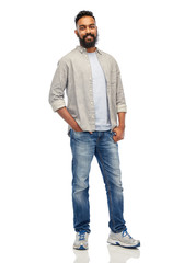 happy smiling indian man over white