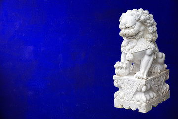 Chinese Imperial Lion, also called Guardian Lion on gold  wall background