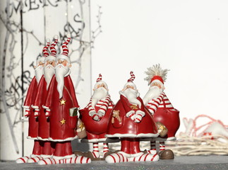 sixpac, three thin santas and three thick santas standing together