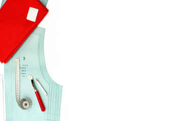 Sewing background. Copyspace with paper pattern, sewing tools and accessories