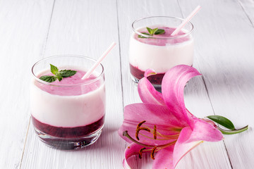 Berry smoothie with yogurt and flower