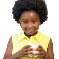 Cute afro american kid holding glass with milk.