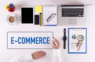 Businessman Writing the Words E-COMMERCE Concept