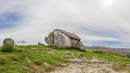 Casa do Penedo, a house built between huge rocks on top of a mountain in Fafe, Portugal. Commonly considered one of the strangest houses in the world.