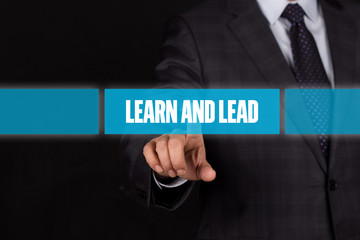 Hand pushing on a touch screen interface-LEARN AND LEAD button