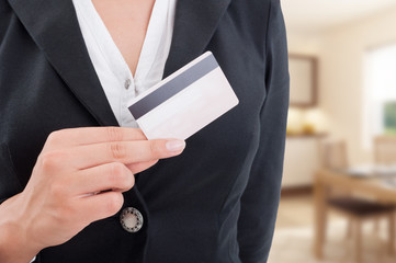 Female broker with debit card in closeup