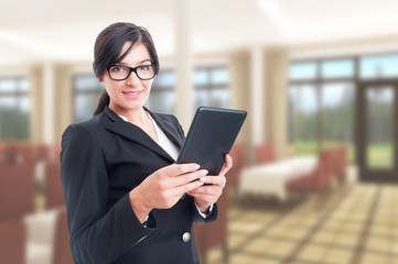 Confident sales agent browsing on digital tablet