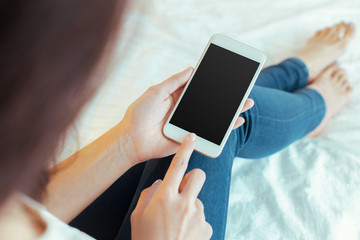 Woman with modern mobile phone in hands